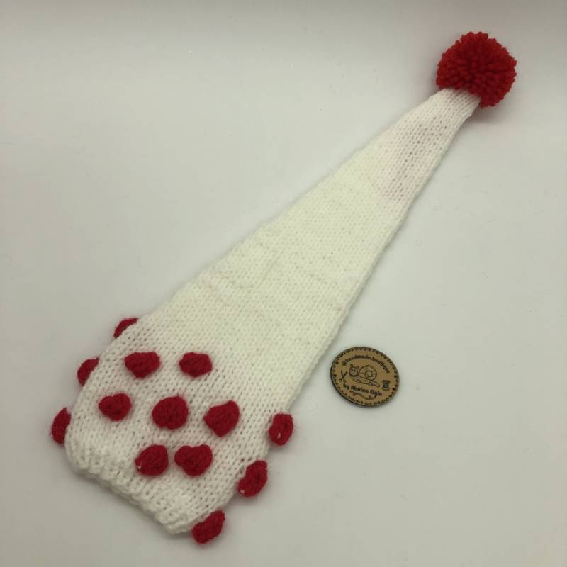 White hat with red points and red pompon