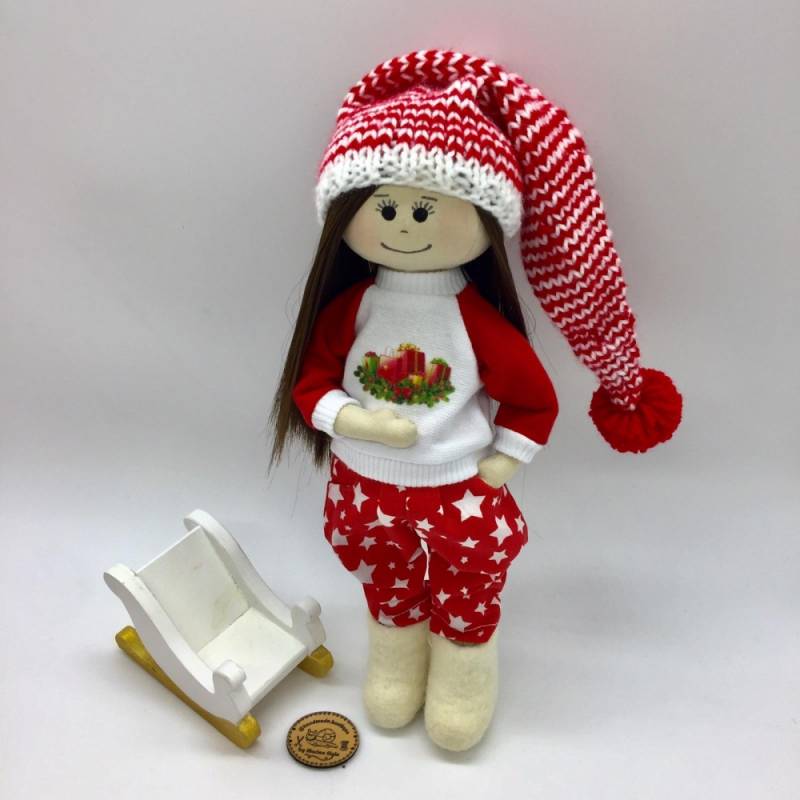 Christmas doll with black hair and black eyes