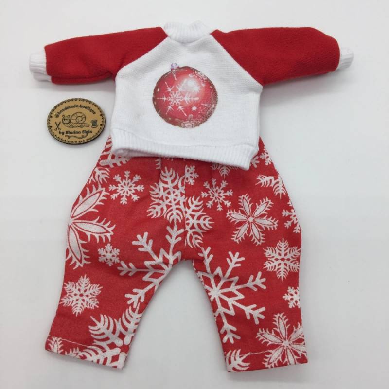 Red trousers and sweatshirt with christmas bauble