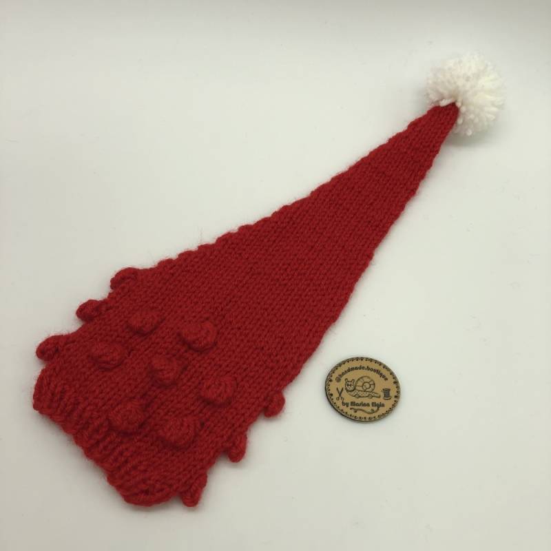 Red hat with red points and white pompon