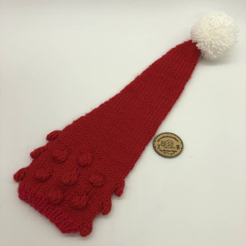 Red hat with white pompon