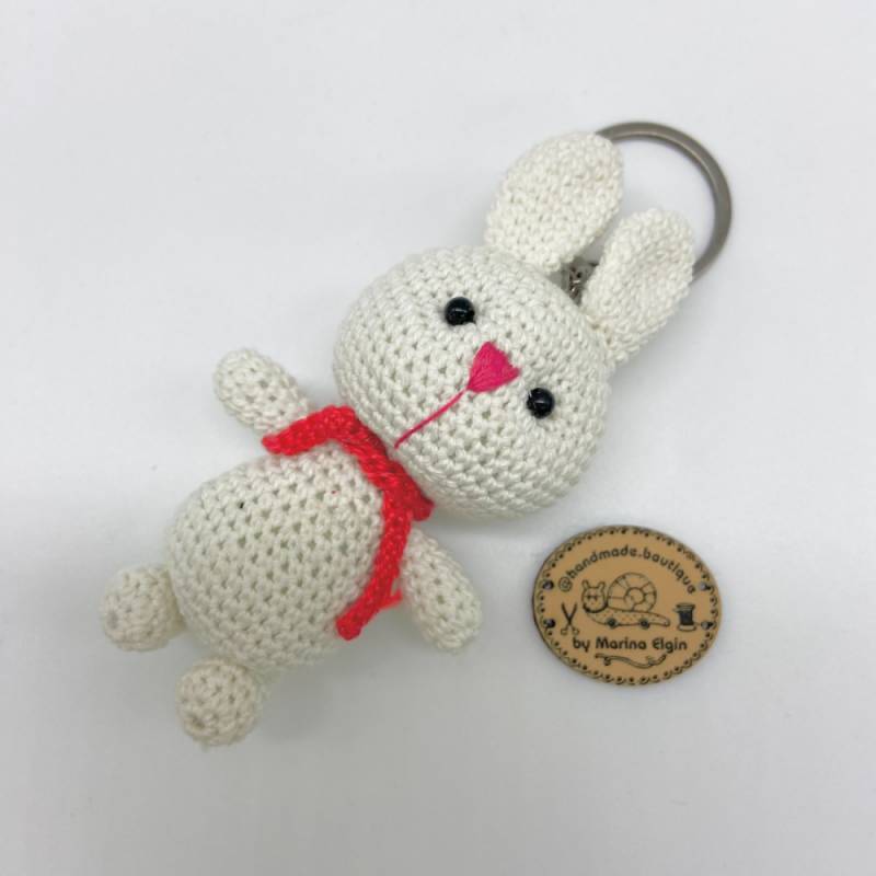 White rabbit with red scarf