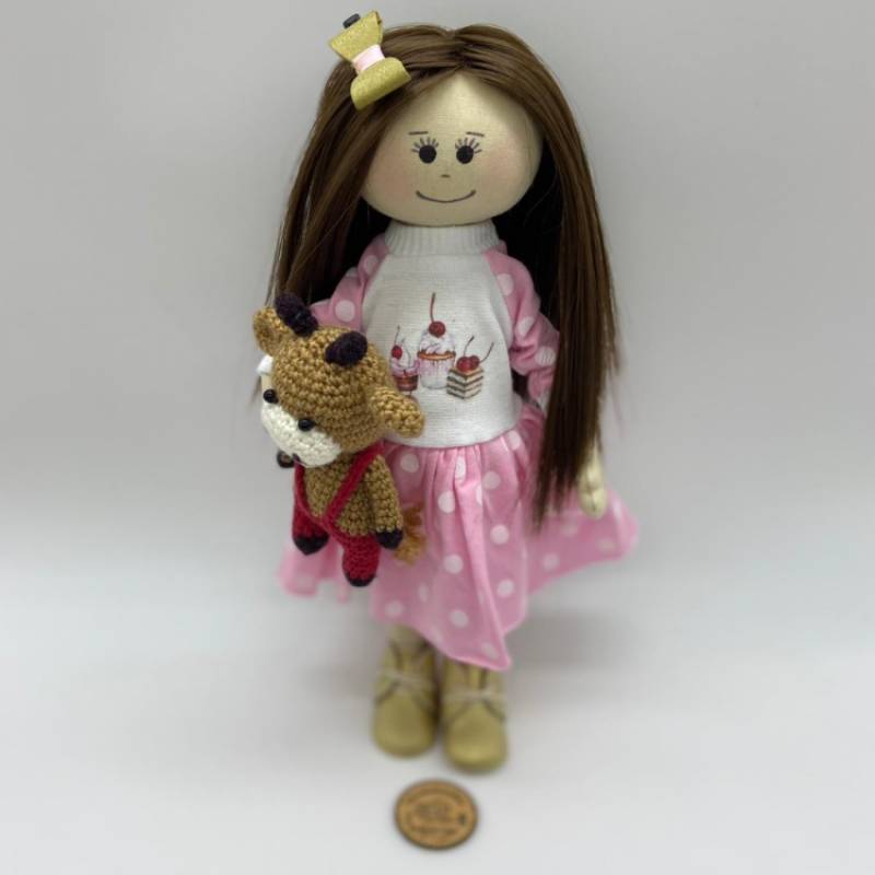  Rag doll with a pink and white dotted dress